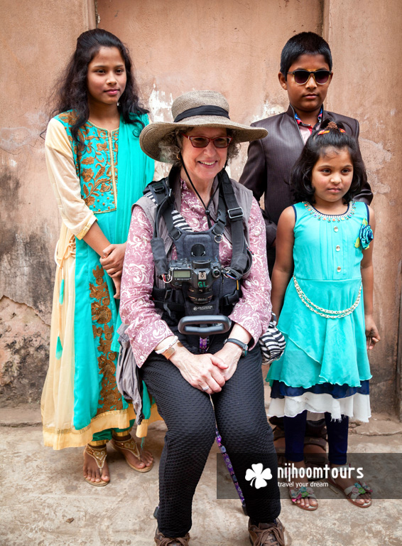 Janice Friend taking photo with children in Bangladesh