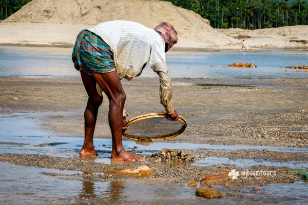 Collecting stone from shallow river in Jaflong Collecting stone from shallow river in Jaflong