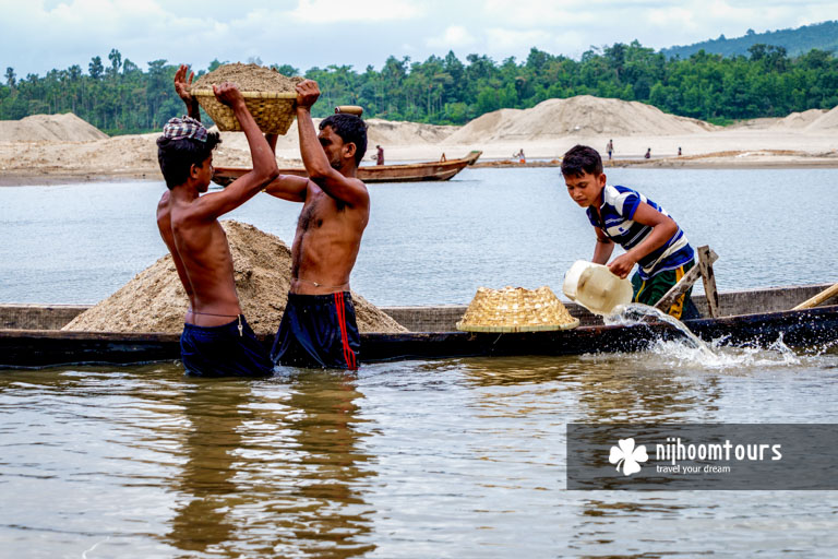 People collecting sand from the riverbed in Jaflong - number eight among the best places to visit in Bangladesh