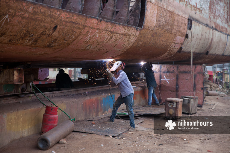 Photo of work in Dhaka Shipyards - one of the best places to visit in Dhaka City for photography